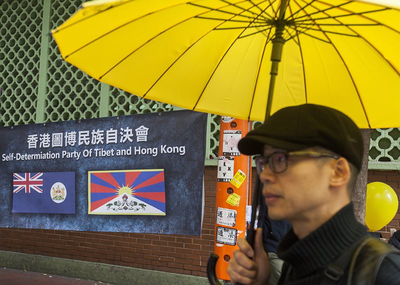 С жълти чадъри в ръка, жителите на Хонконг настояваха за всеобщо избирателно право