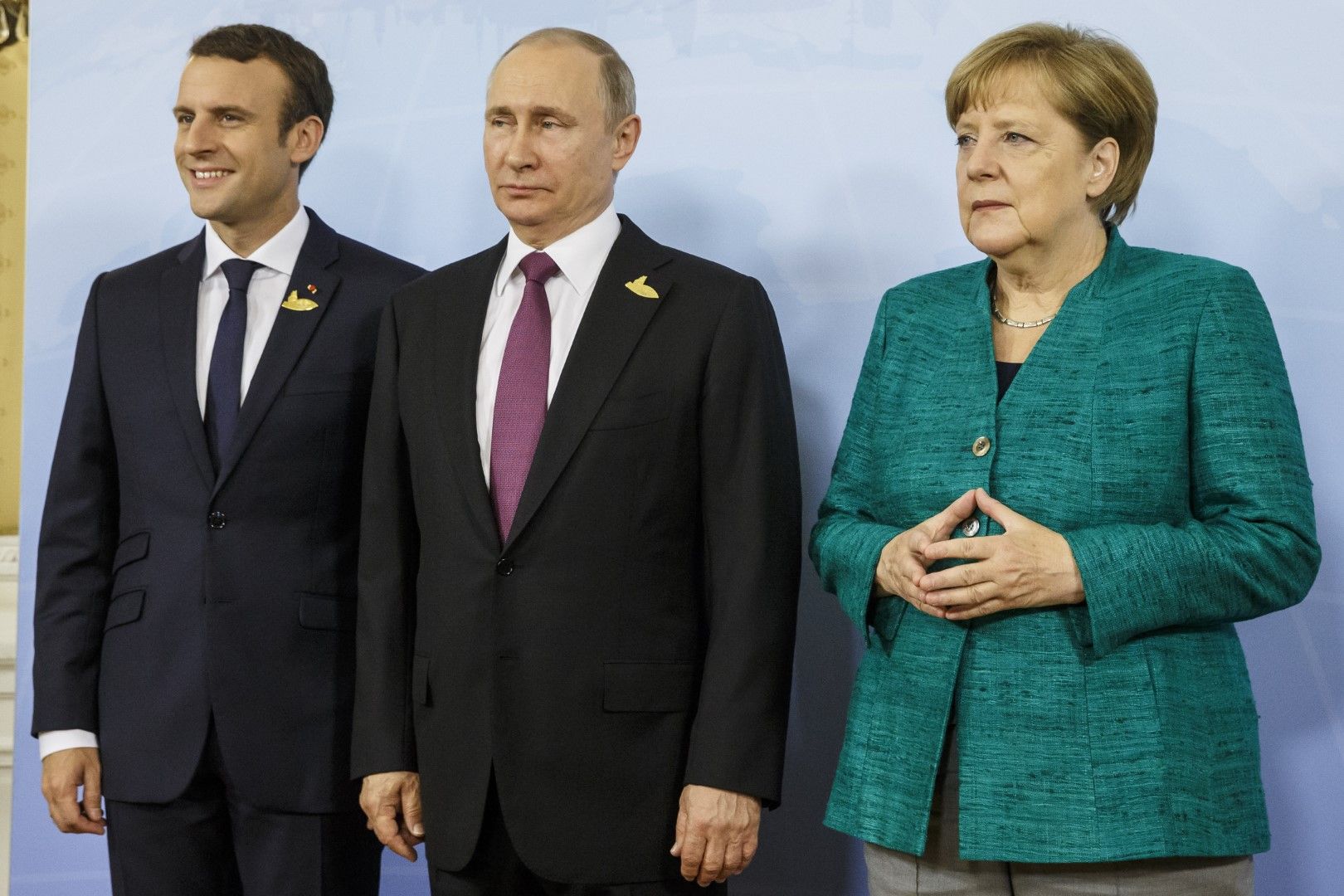 Еманюел Макрон, Владимир Путин и Ангела Меркел по време на срещата на Г-20 в Хамбург, 8 юли 2017 г.