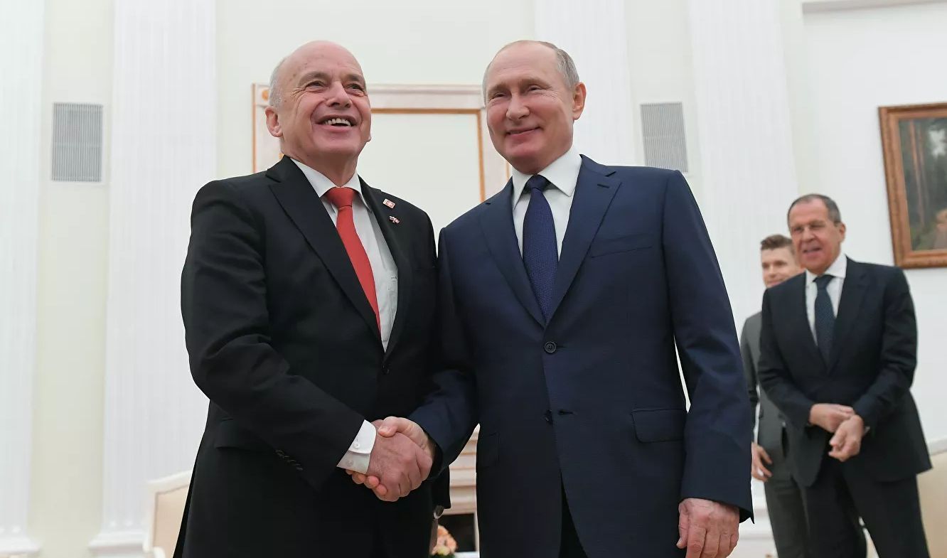 Ули Маурер (вляво) и Владимир Путин