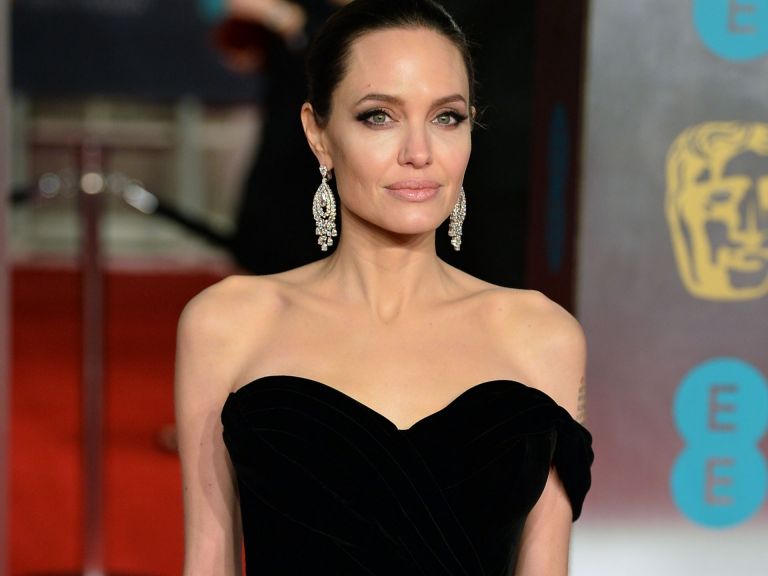 Angelina Jolie mingles with bargain shoppers at H&M on London's