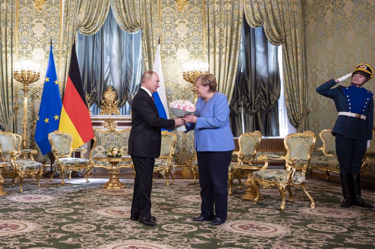 Before the meeting, the Russian president presented a bouquet of flowers to the German chancellor and said that 