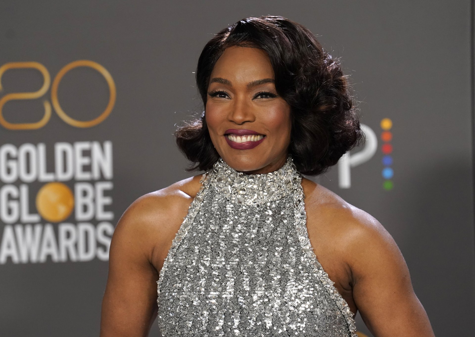 Angela Bassett with a Golden Globe Award for her supporting role in Black Panther: Wakanda Forever