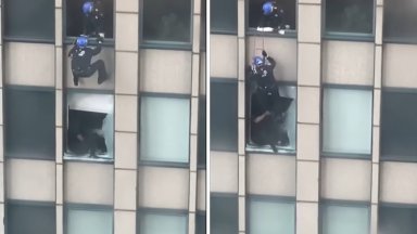 Полицай се спусна с въже по фасадата на небостъргач в